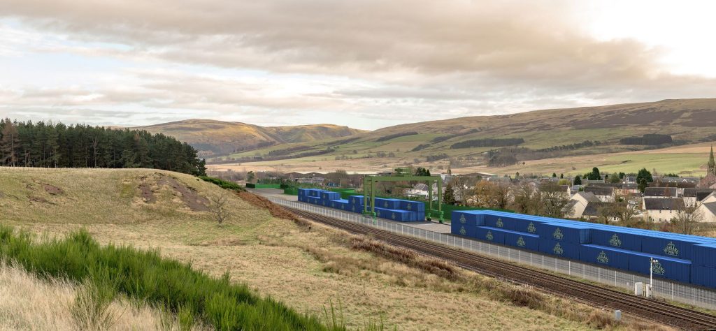 blue coloured rail freight cars docked at the rail freight facility.